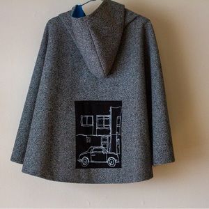 Rain cape made from scholar fabric. One size fits all, water resistant and warm.